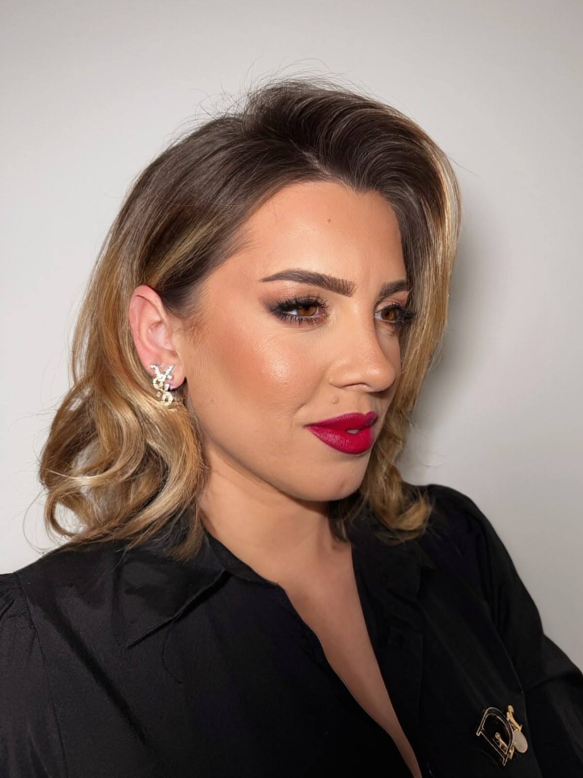 Blonde bob with volume and a classic red lip