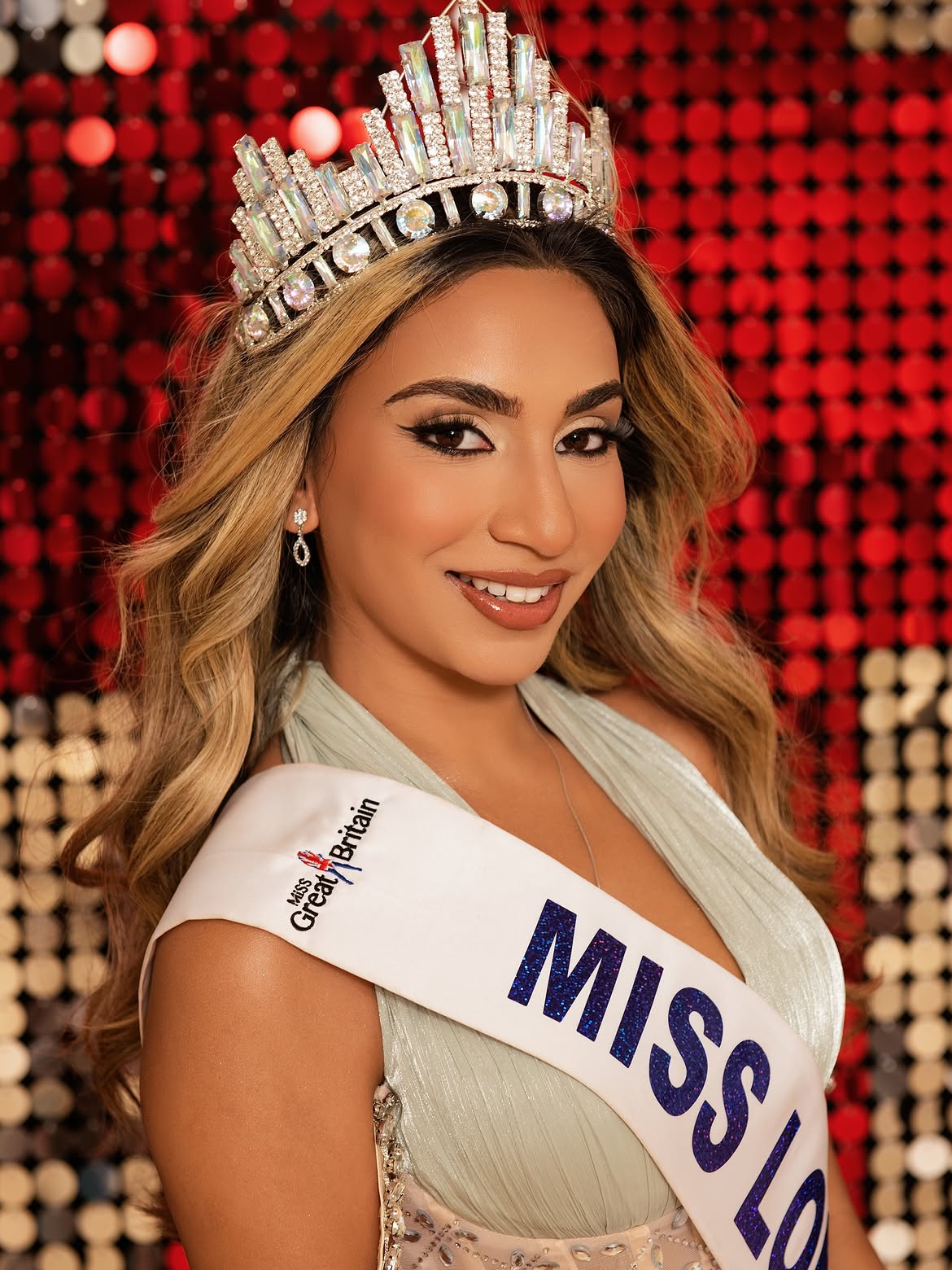 Pageant glam with a crown and bronzed smokey eye