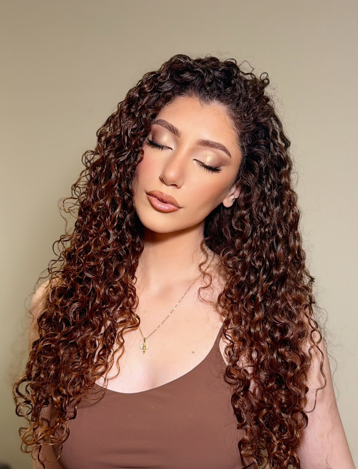 Gold shimmer eye finished with defined spiral curls